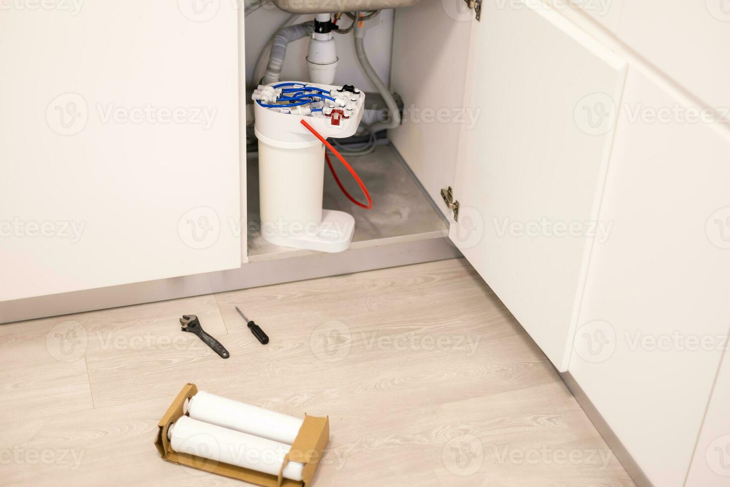 Installation of reverse osmosis water purification system. photo