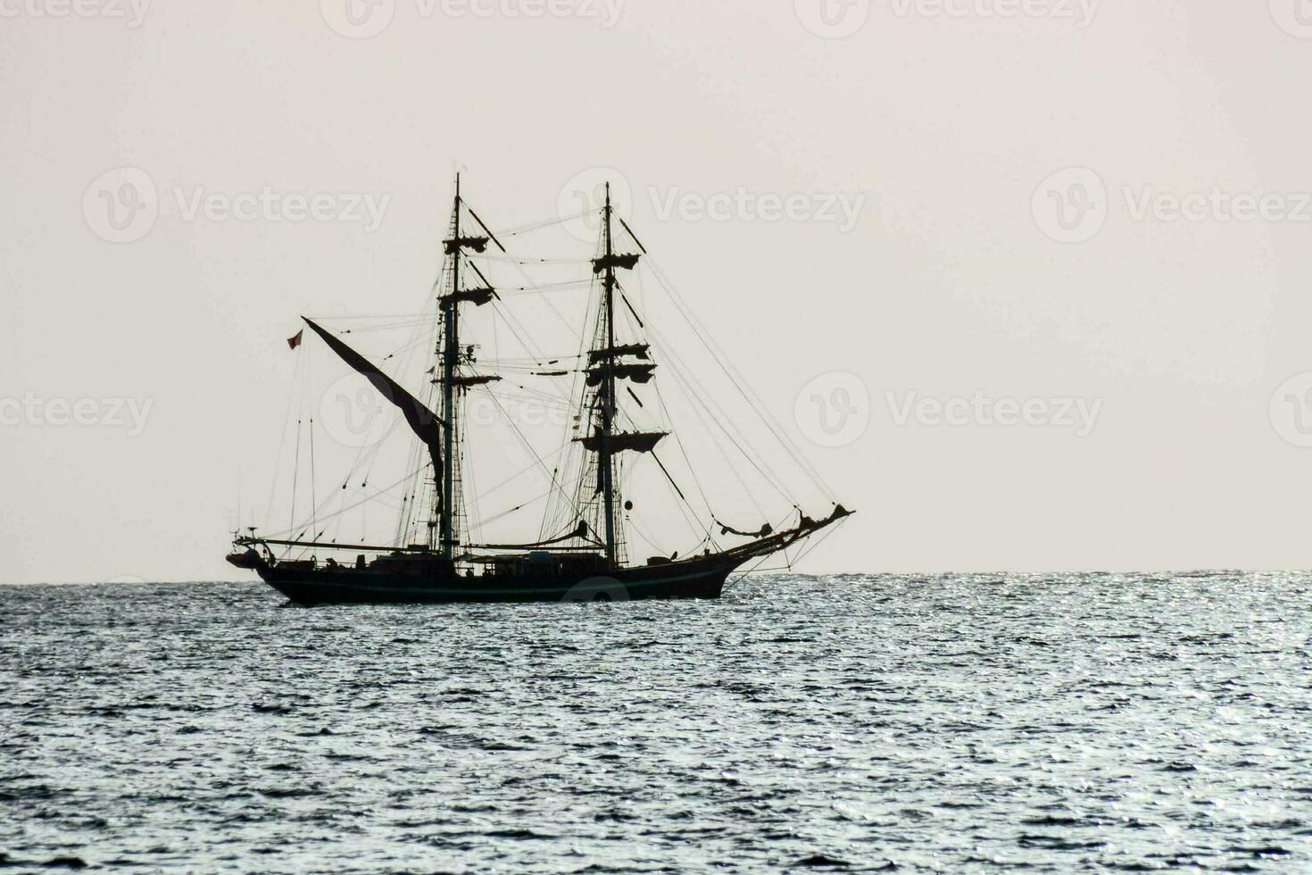 a tall ship in the ocean photo