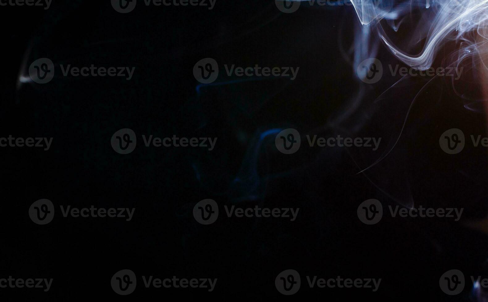 Smoke fragments on a black background photo