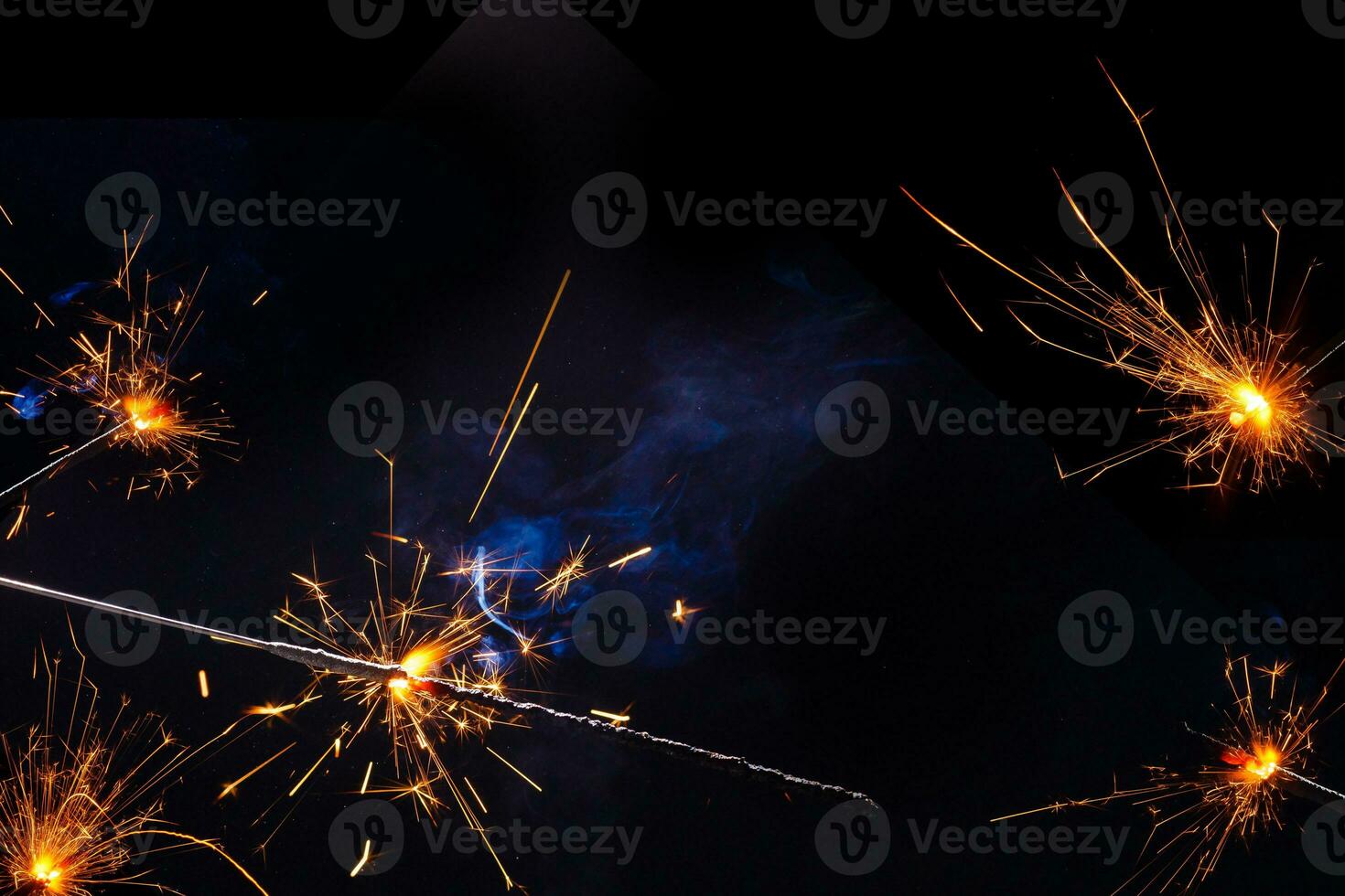 A lit sparkler showing bright sparks photo
