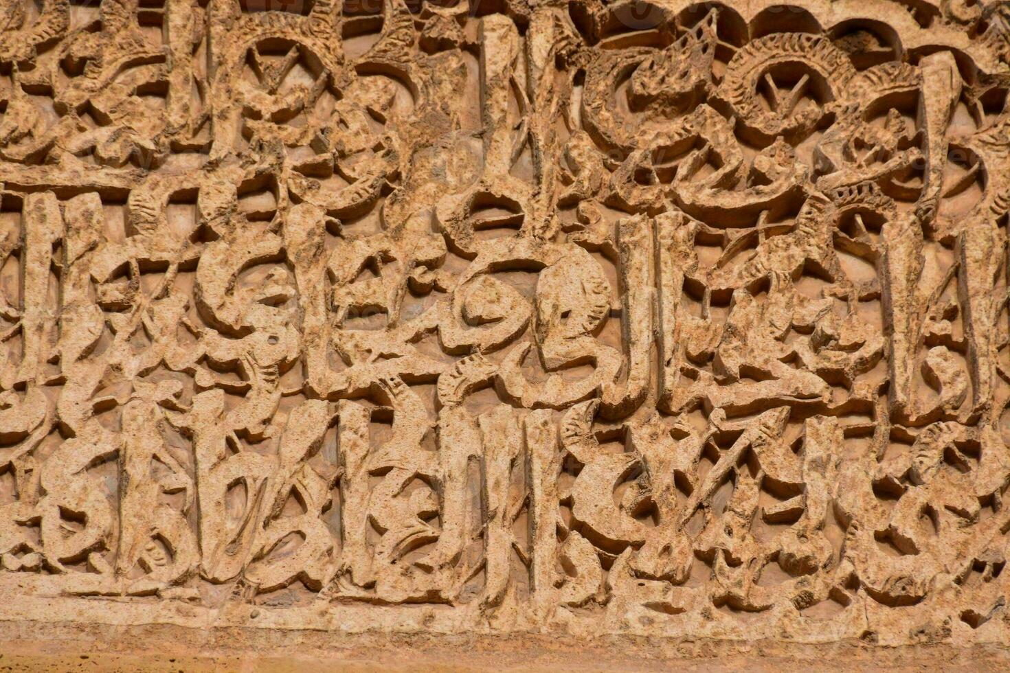 the carvings on the wall of the mosque photo