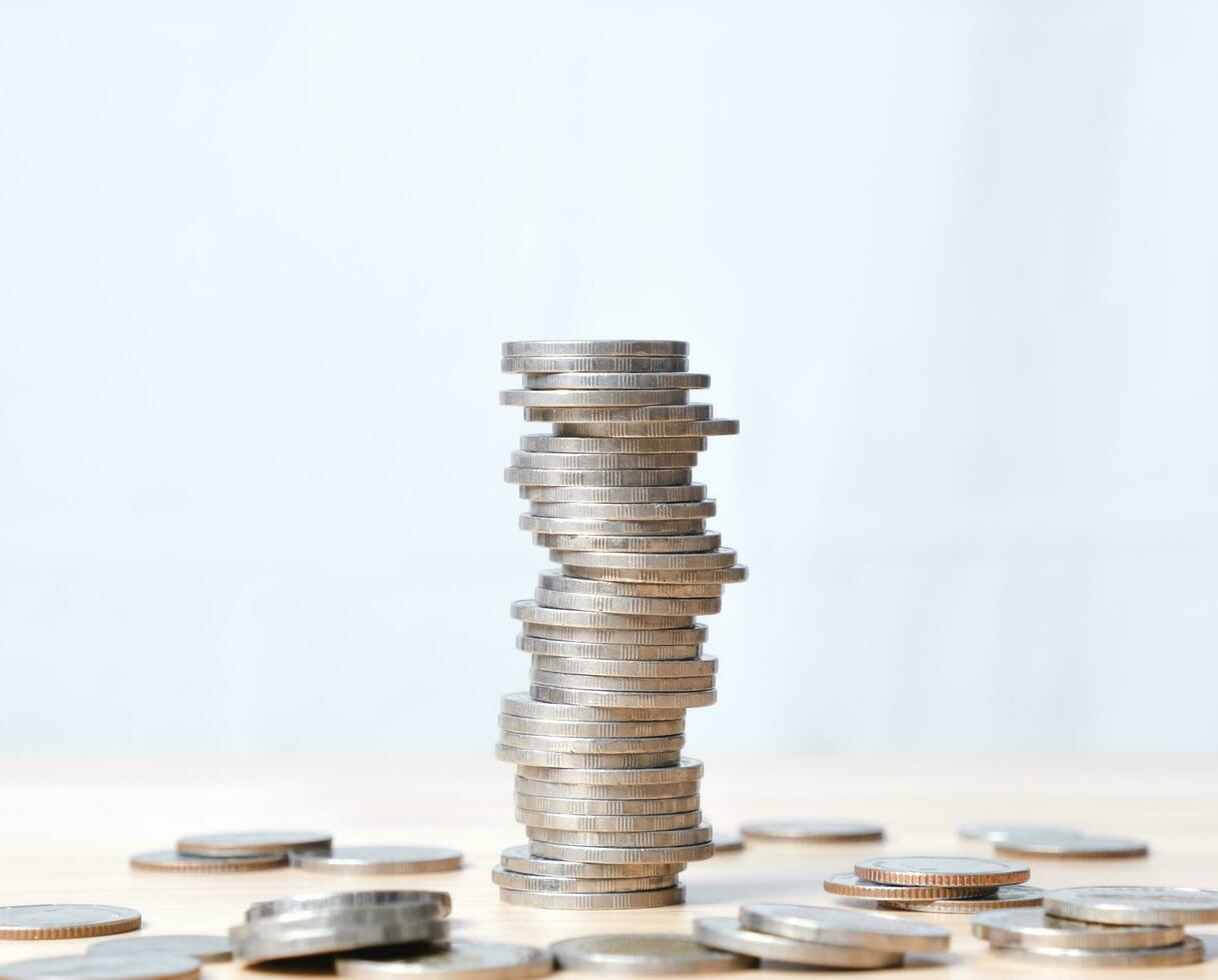 coins stacked high on each other in different positions. Banking, economics, saving money. photo