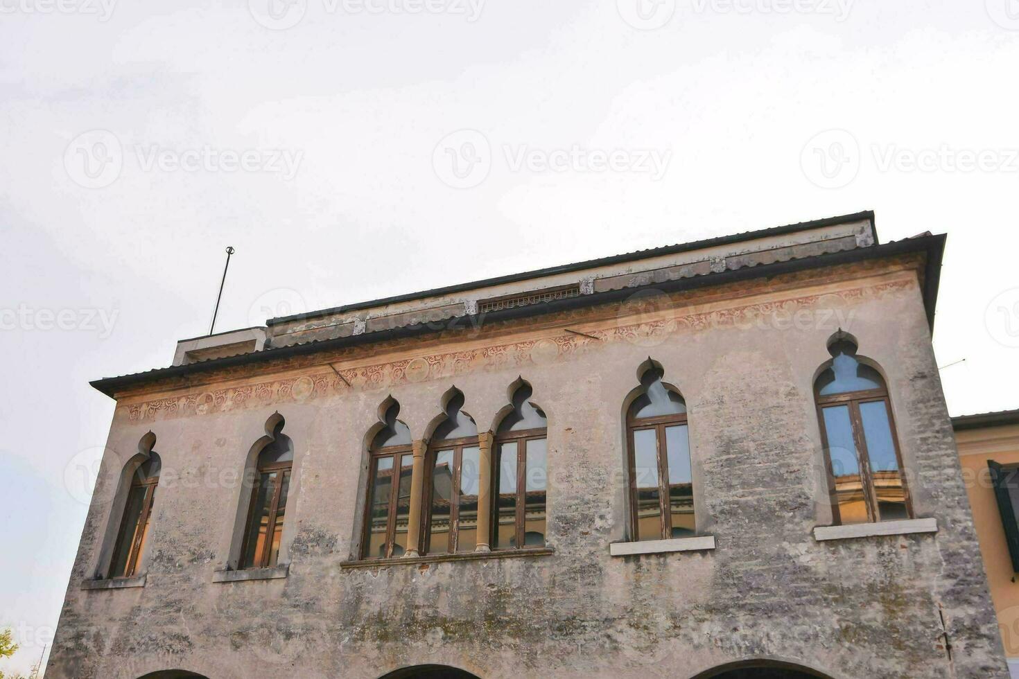 a building with arched windows photo