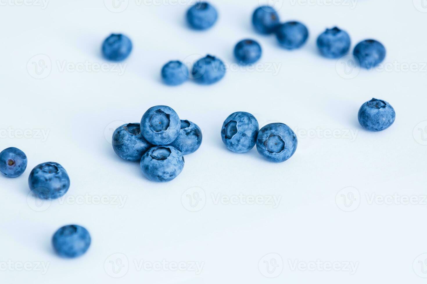 Group of fresh juisy blueberries isolated on white background photo