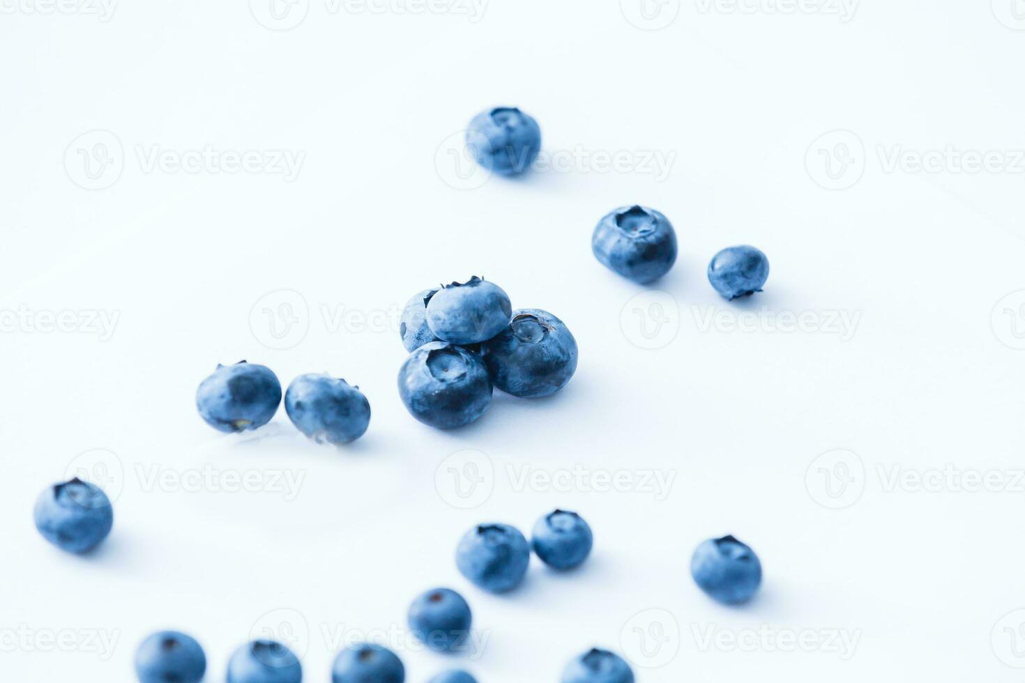 Group of fresh juisy blueberries isolated on white background photo