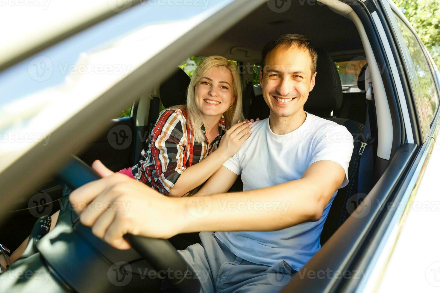 Elderly man driving a car photo