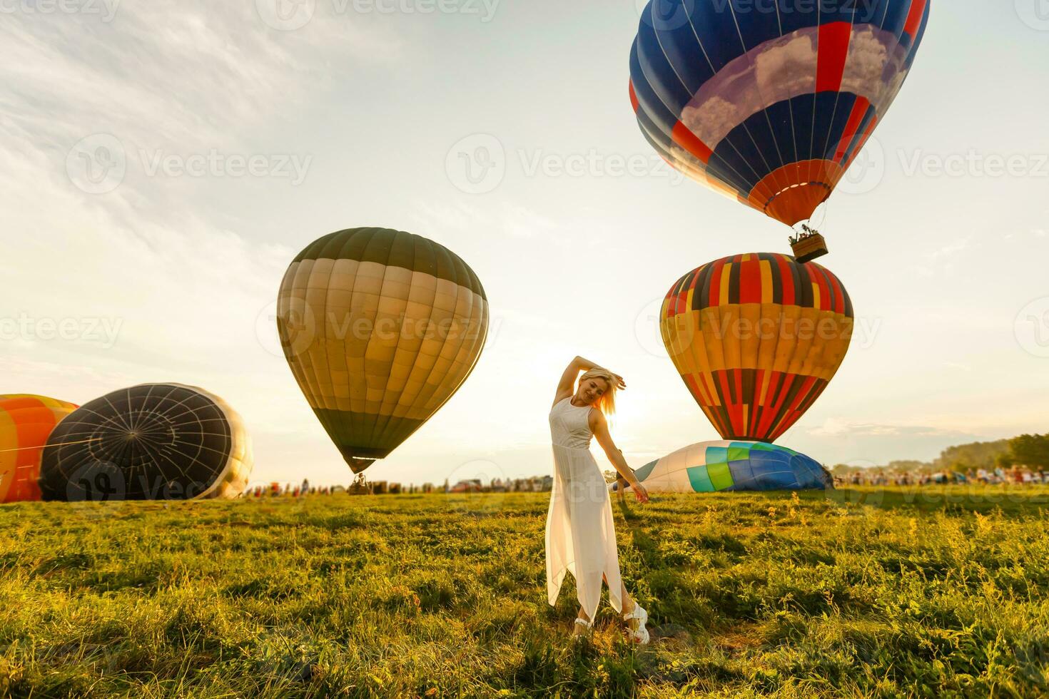 A tourist woman enjoying wonderful view of the balloons. Happy Travel concept photo