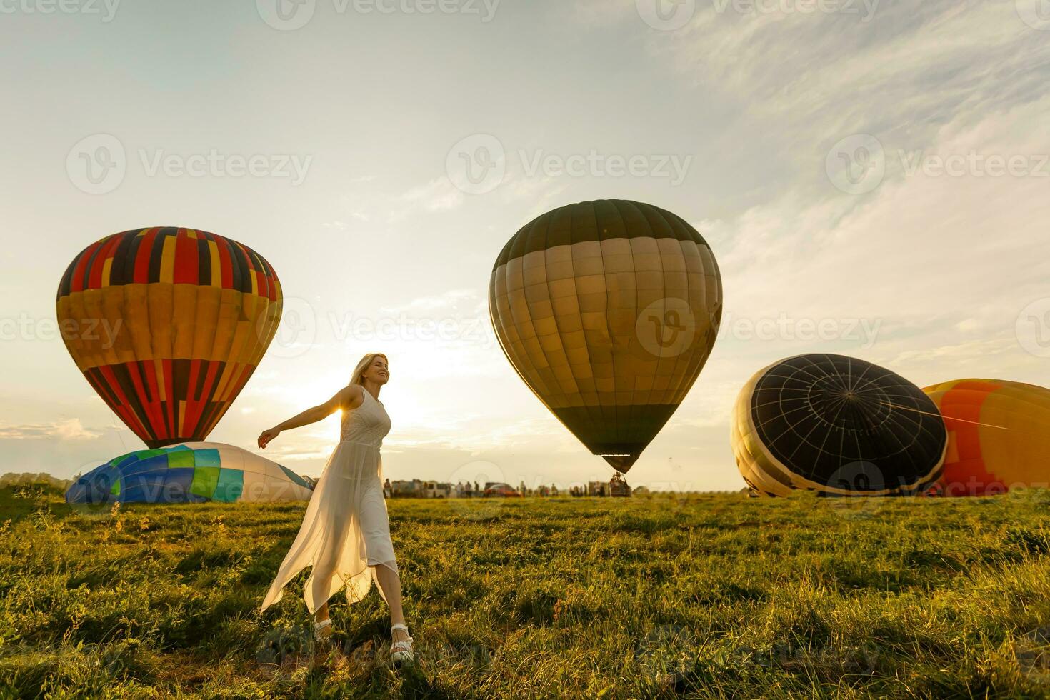 A tourist woman enjoying wonderful view of the balloons. Happy Travel concept photo