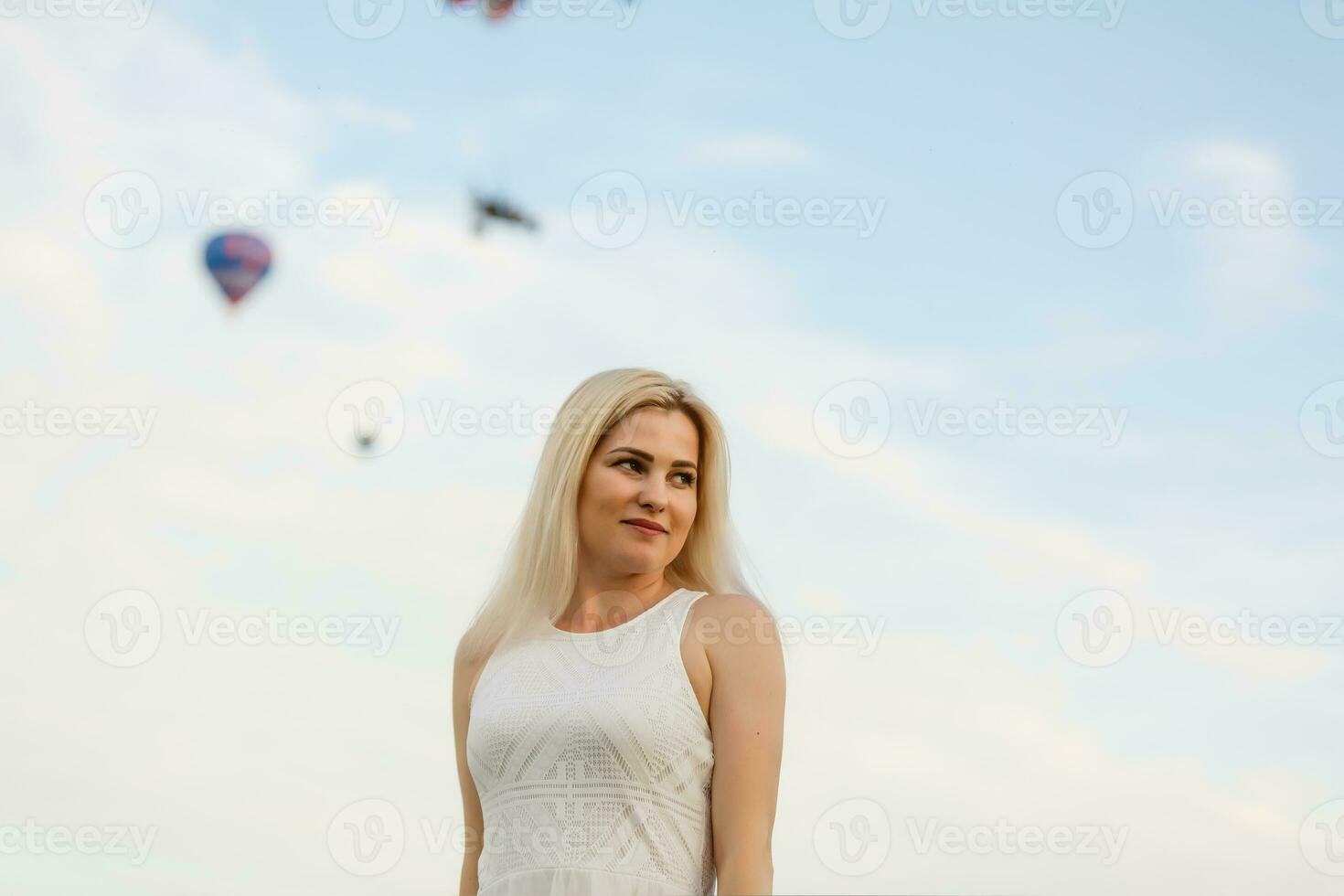 Amazing view with woman and air balloon. Artistic picture. Beauty world. The feeling of complete freedom photo