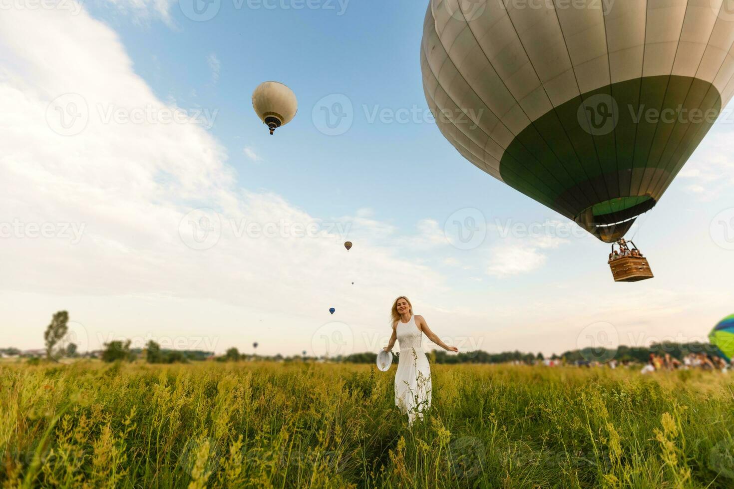 A tourist woman enjoying wonderful view of the balloons. Happy Travel concept photo