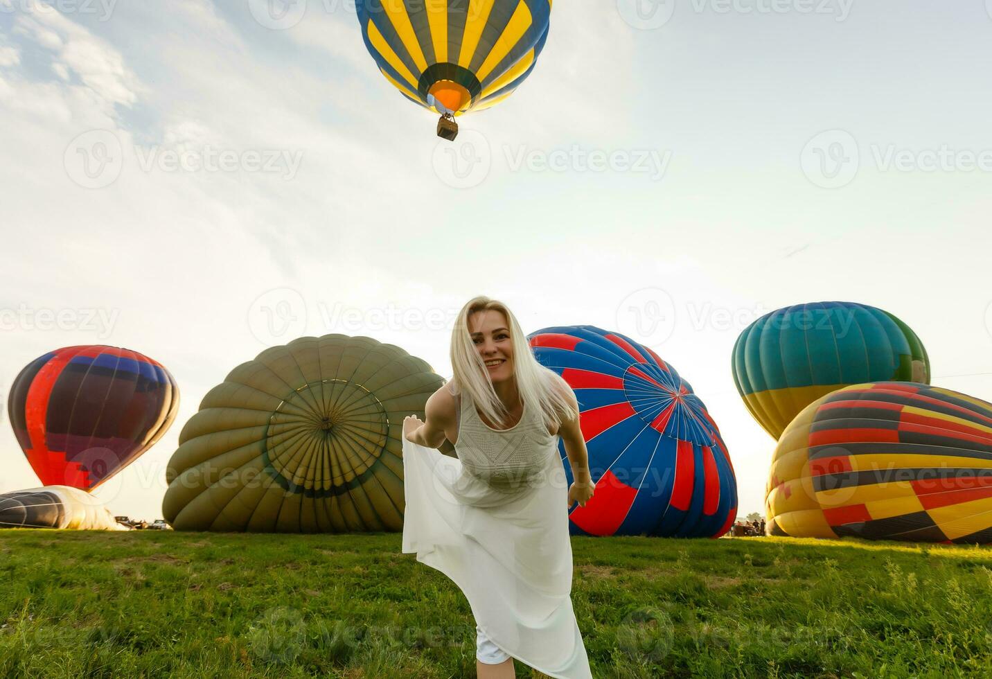 Amazing view with woman and air balloon. Artistic picture. Beauty world. The feeling of complete freedom photo