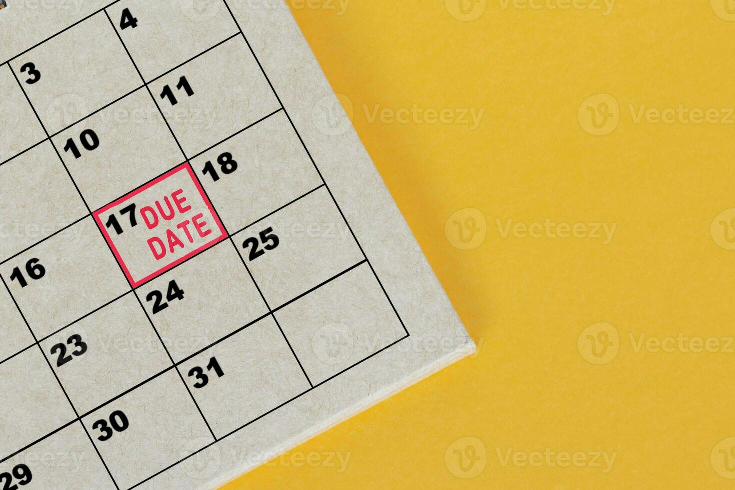 Red mark on the calendar at 17 for reminder of due date. photo