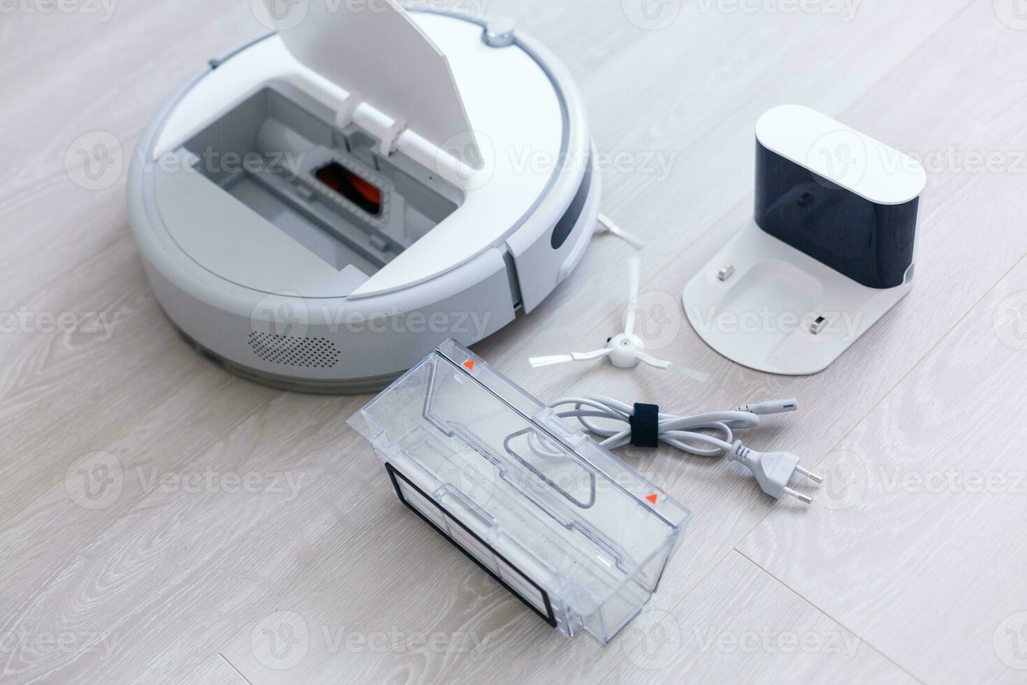 Robotic vacuum cleaner. Container with garbage from a smart robot vacuum cleaner. housework and technology concept photo
