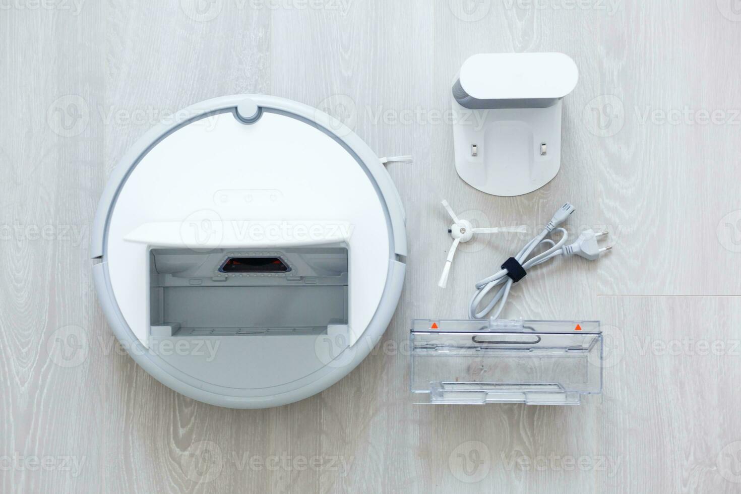 Robotic vacuum cleaner. Container with garbage from a smart robot vacuum cleaner. housework and technology concept photo