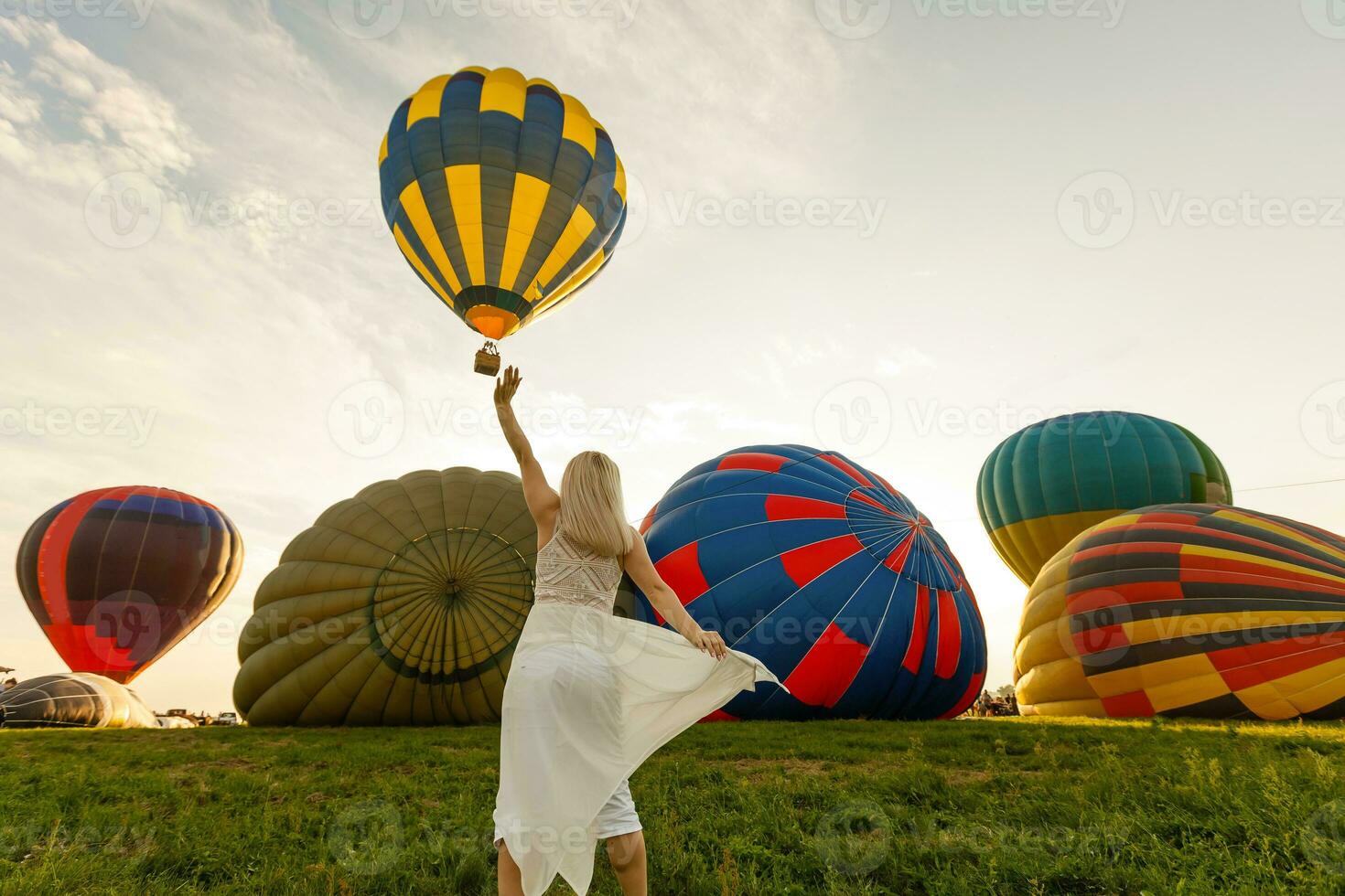 Amazing view with woman and air balloon. Artistic picture. Beauty world. The feeling of complete freedom photo