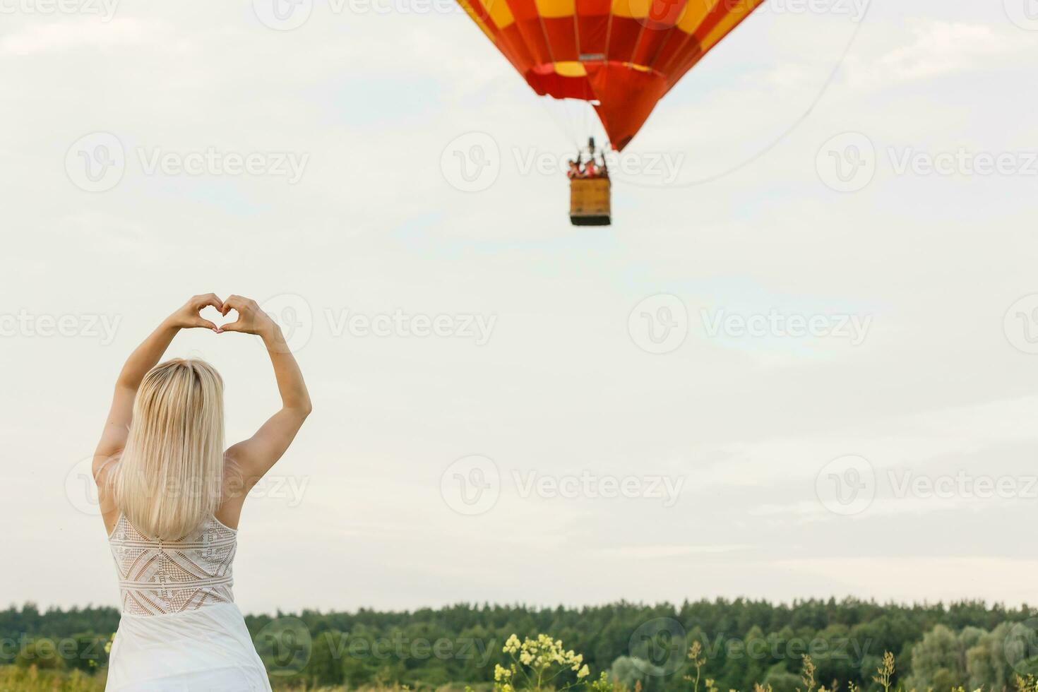 A tourist woman enjoying wonderful view of the balloons. Happy Travel concept photo