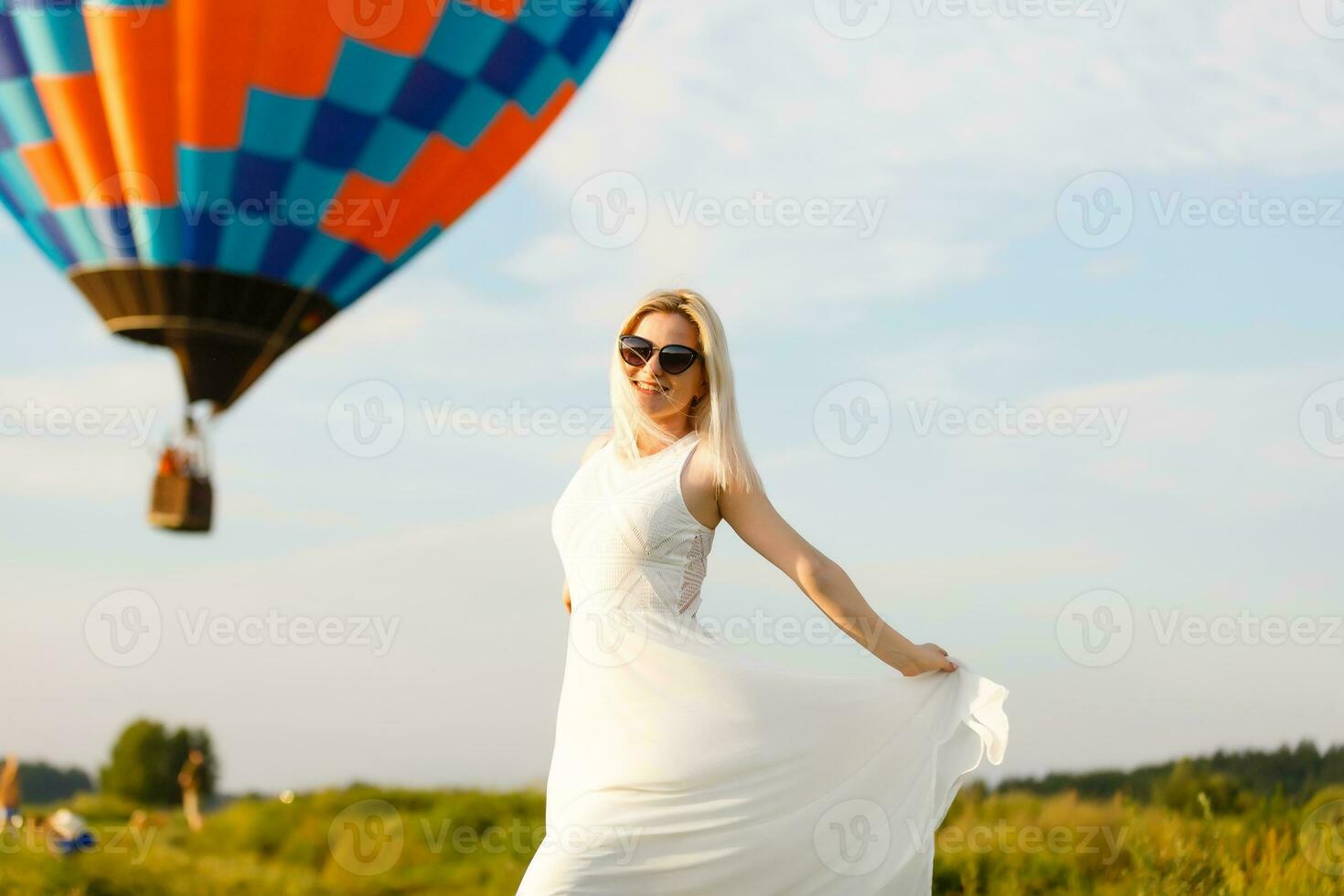 Amazing view with woman and air balloon. Artistic picture. Beauty world. The feeling of complete freedom photo