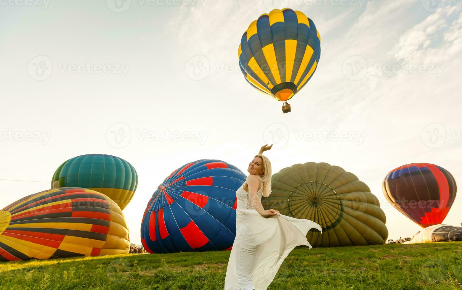 A tourist woman enjoying wonderful view of the balloons. Happy Travel concept photo