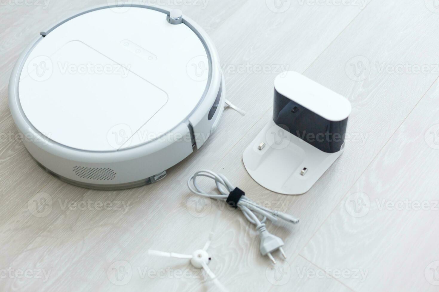 Robotic vacuum cleaner. Container with garbage from a smart robot vacuum cleaner. housework and technology concept photo