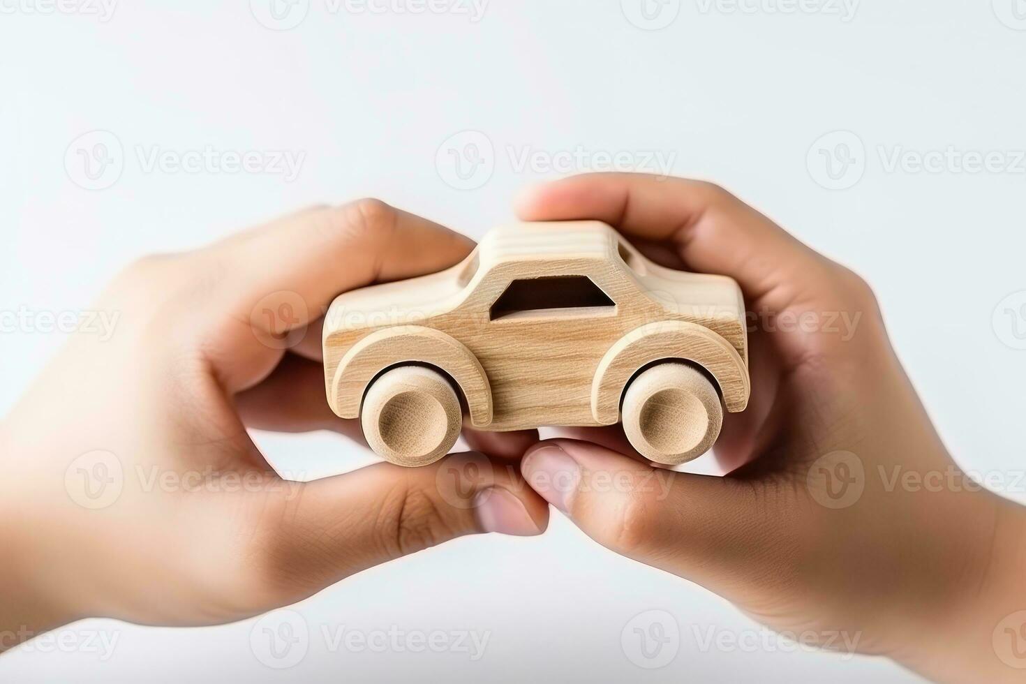 AI generated Child hand playing with natural wooden car toy on white background with copy space for text. photo