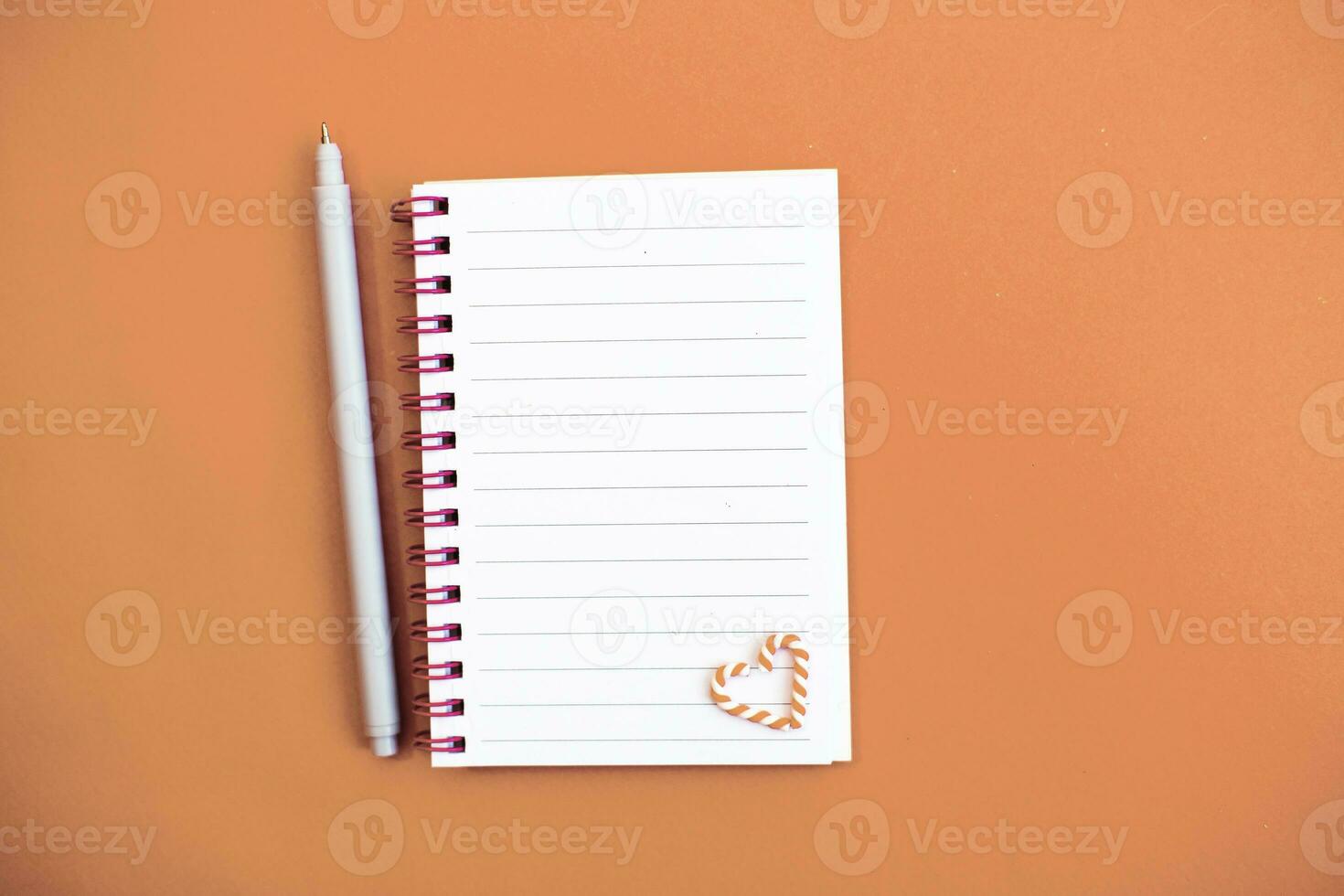 Top view of white paper blank notebook for writing wish list. photo