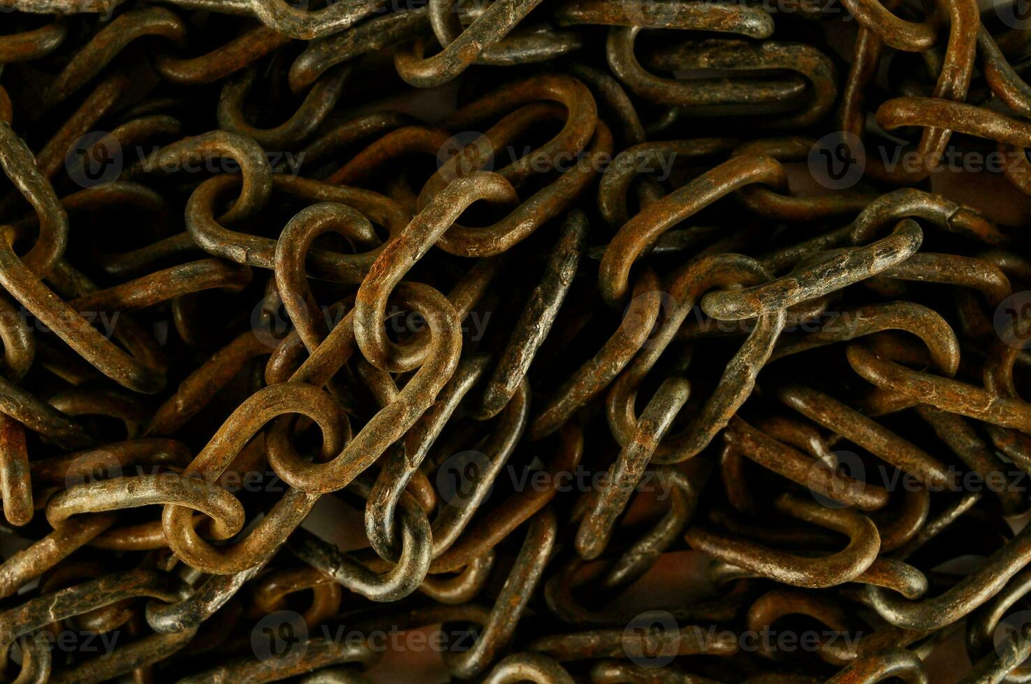 a pile of old metal chains photo