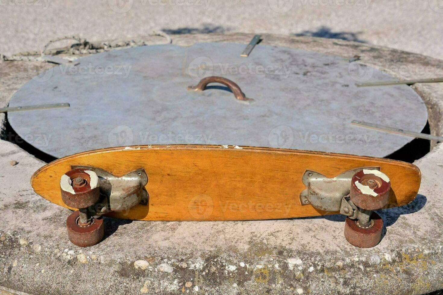 a skateboard is sitting on top of a concrete block photo