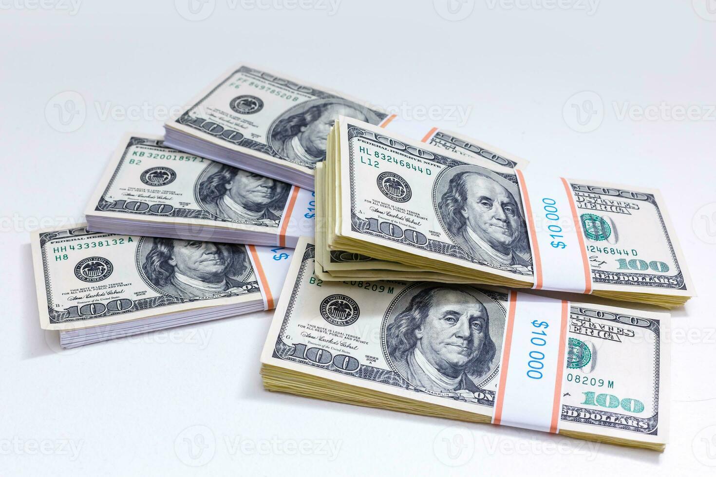 Set of a packs of dollars with a rubber band isolated on a white background photo