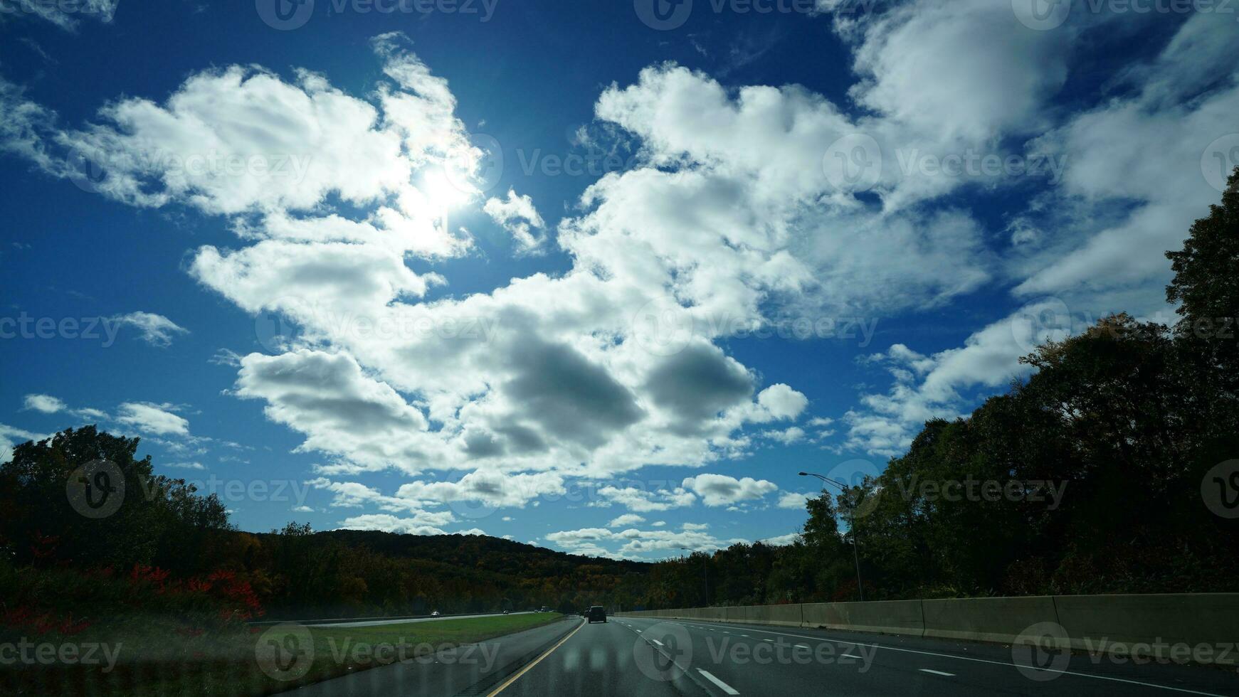 The highway landscape with side view and cloudy sky as background photo
