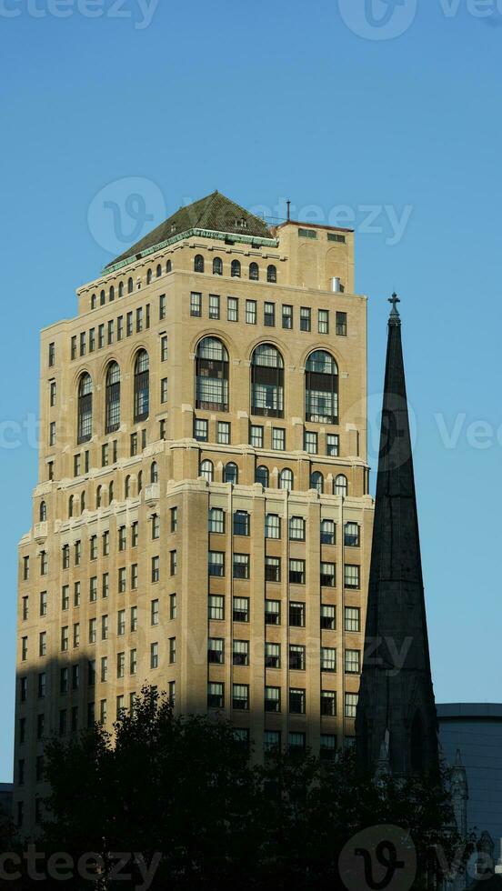 The city view with the old buildings and architectures under the warm sunlight photo