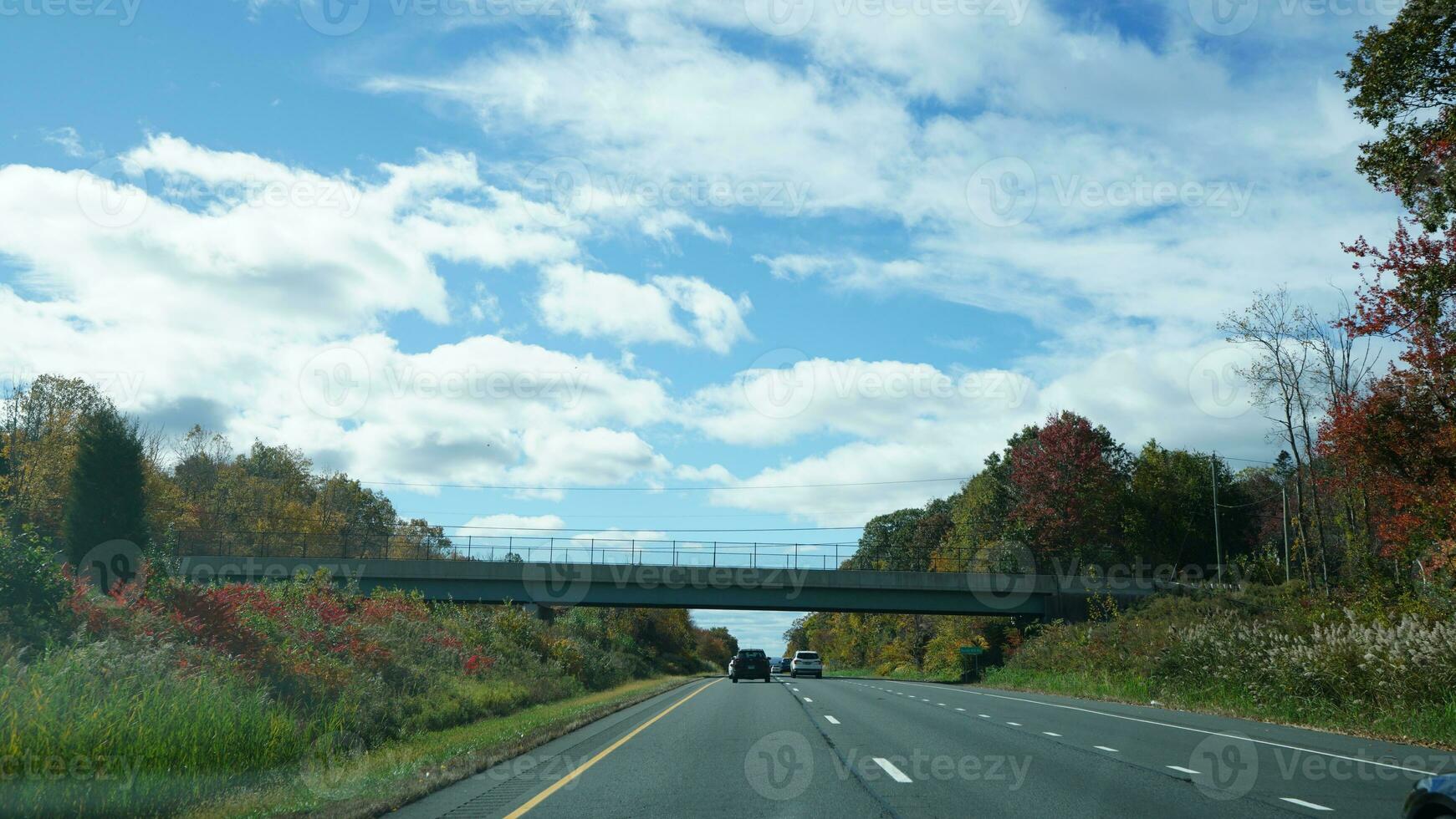The highway landscape with side view and cloudy sky as background photo