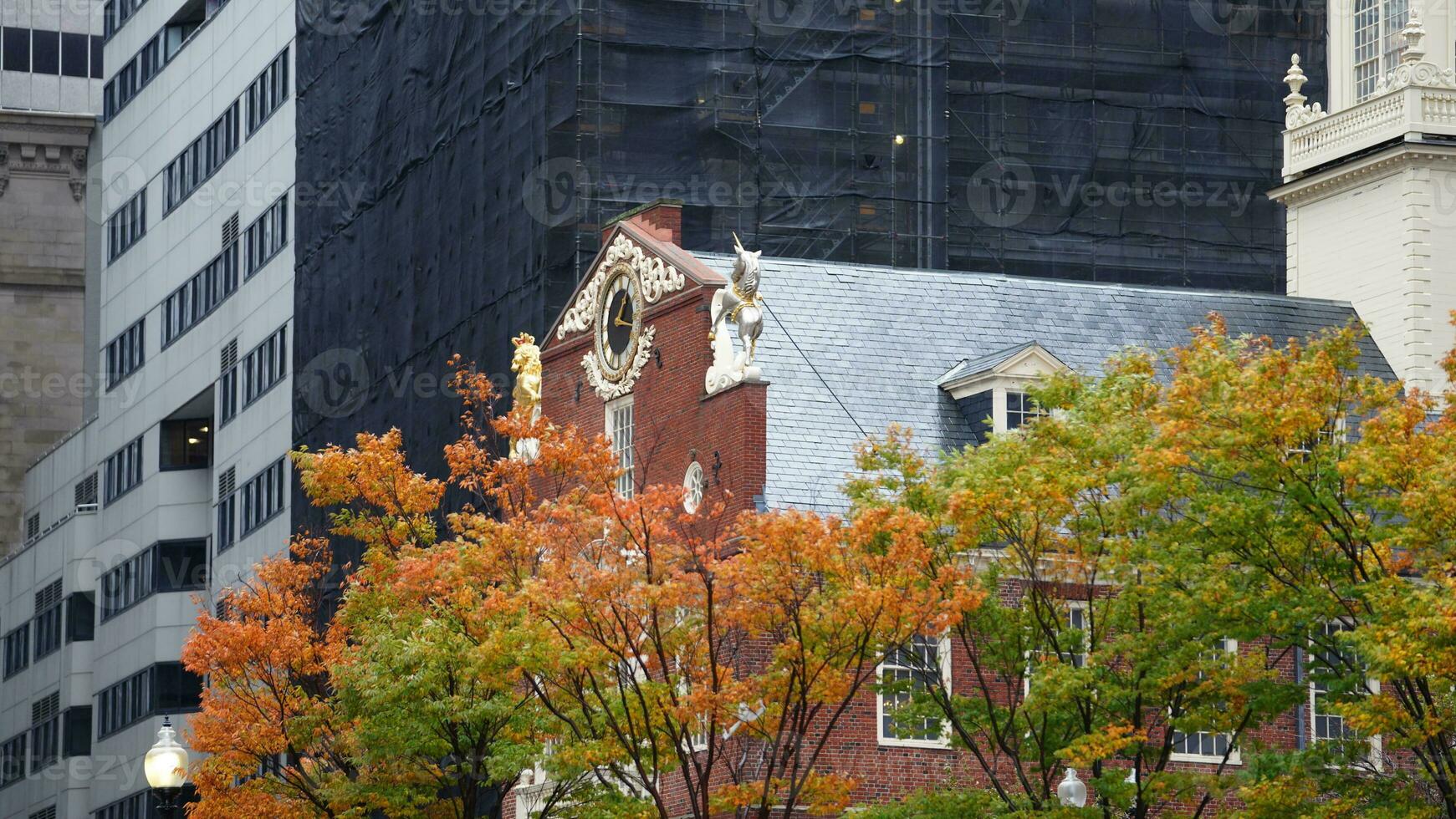 The beautiful campus autumn view with the colorful trees and leaves in the rainy day photo