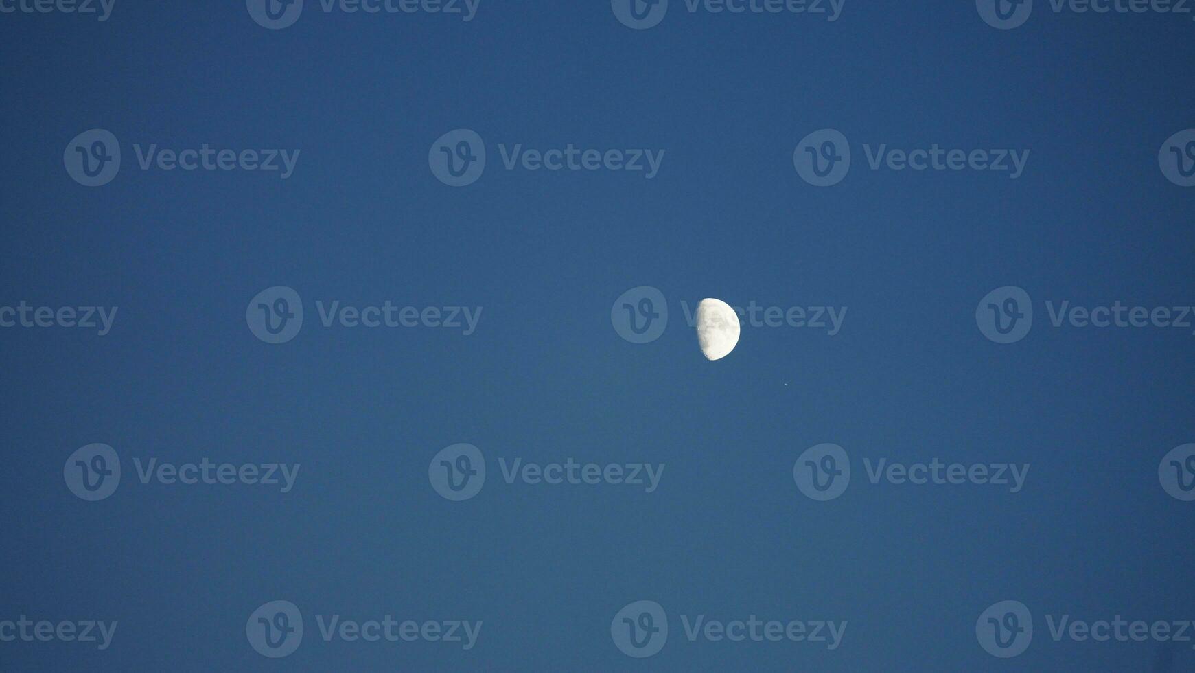 The moon night view with the full moon and clouds in the sky photo
