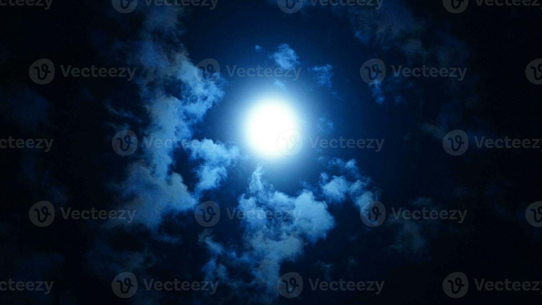 The moon night view with the full moon and clouds in the sky photo
