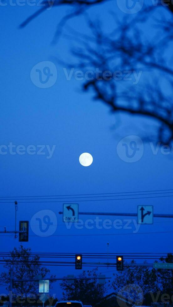 The moon night view with the full moon and clouds in the sky photo