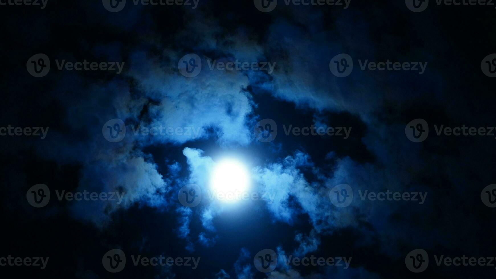 The moon night view with the full moon and clouds in the sky photo