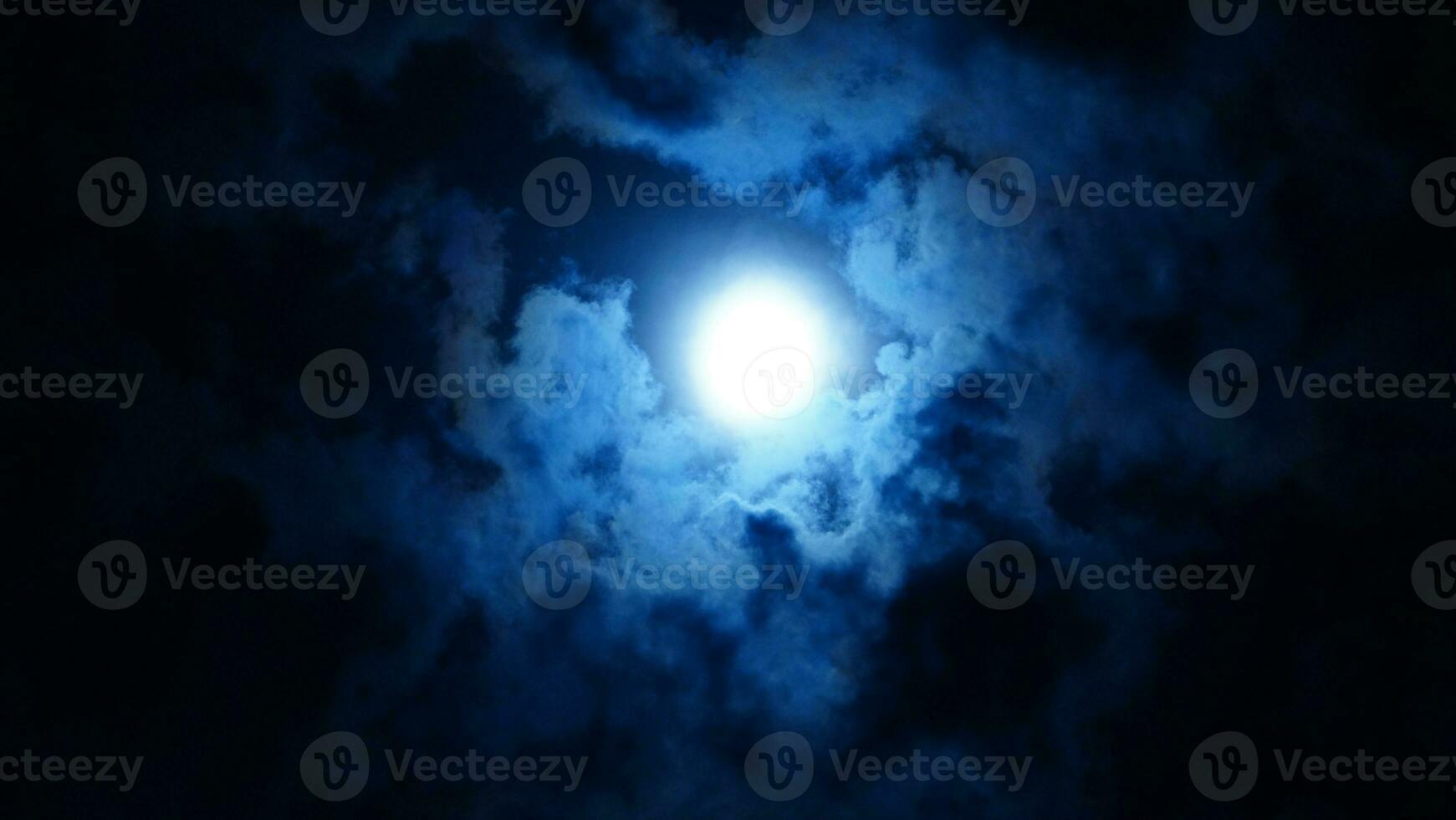 The moon night view with the full moon and clouds in the sky photo