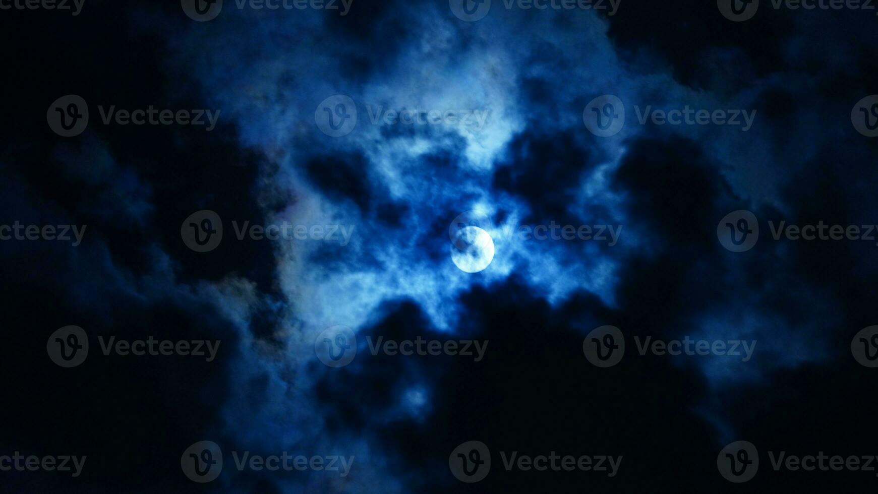 The moon night view with the full moon and clouds in the sky photo