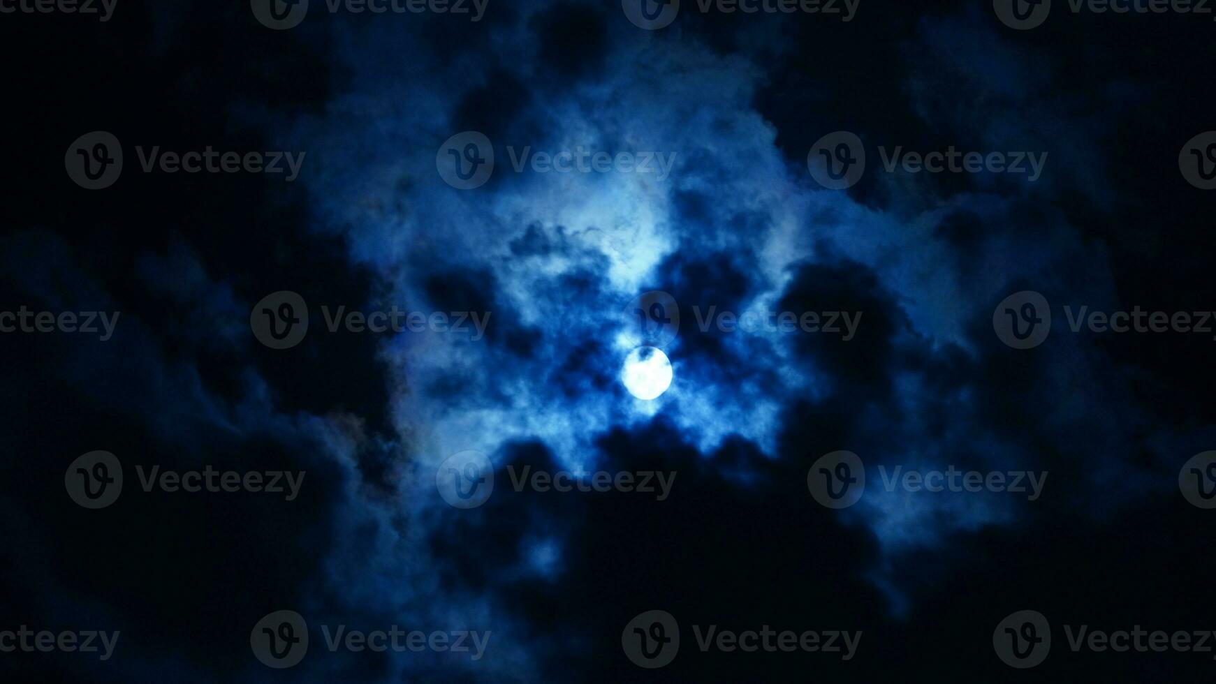 The moon night view with the full moon and clouds in the sky photo