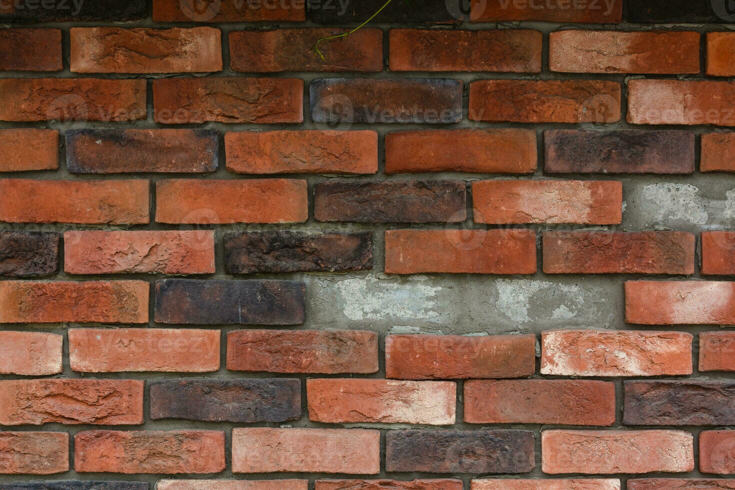 red brick wall texture grunge background with vignetted corners, may use to interior design photo