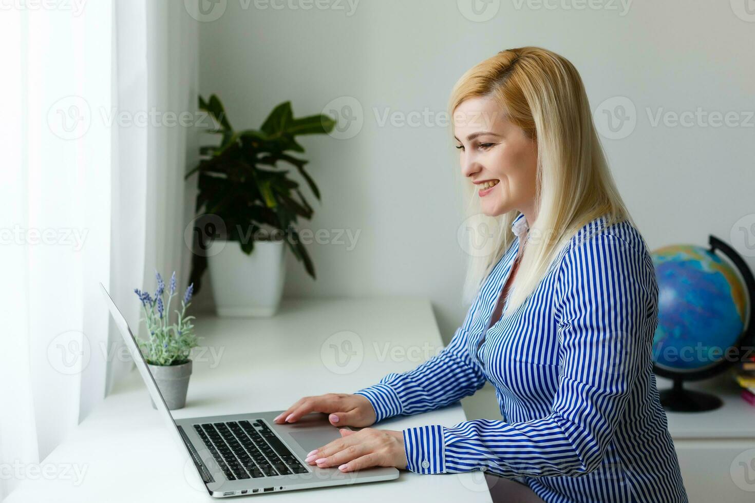 Global communication concept using video conferencing on a laptop photo