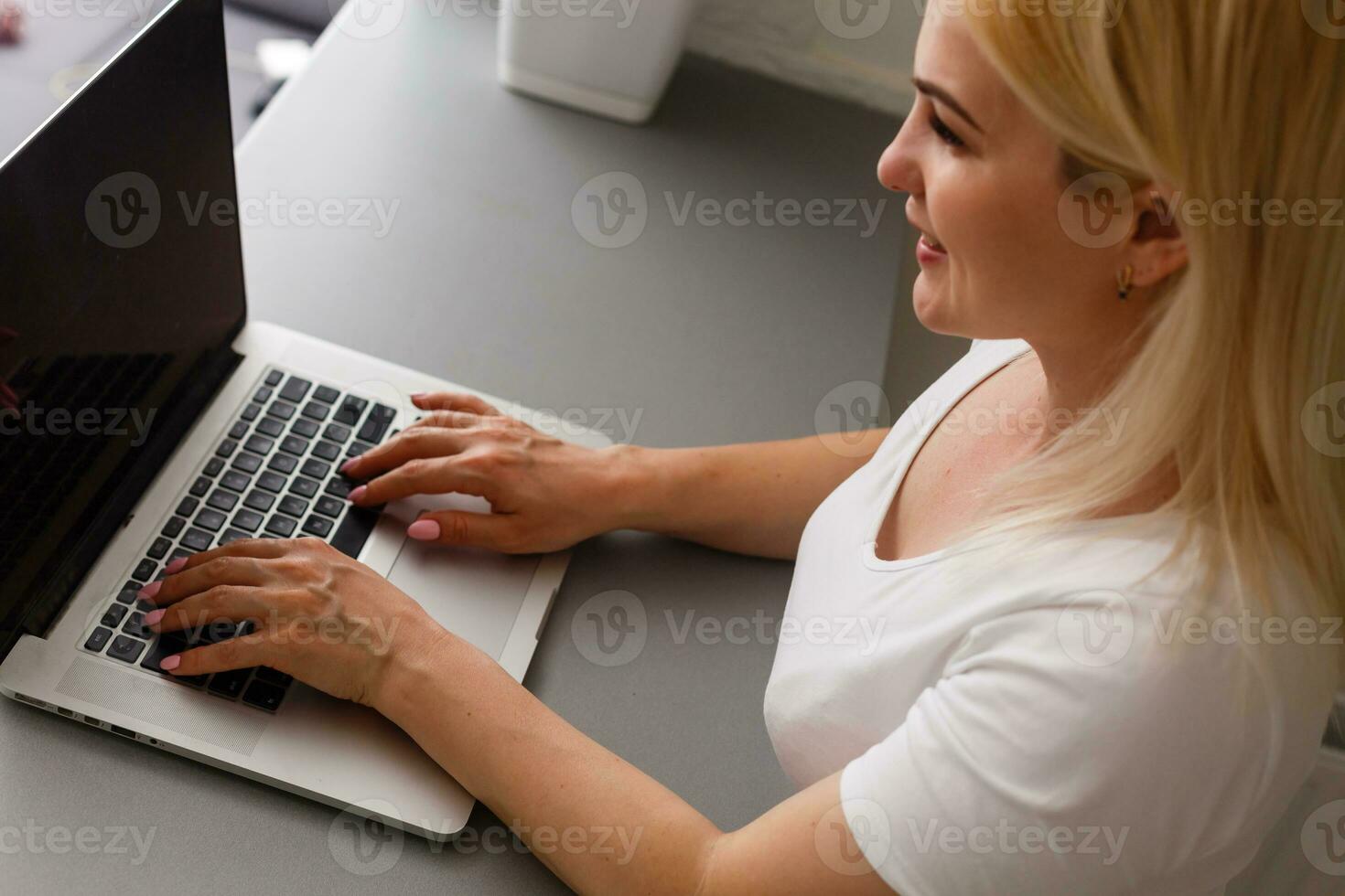 Happy woman doing online shopping at home photo