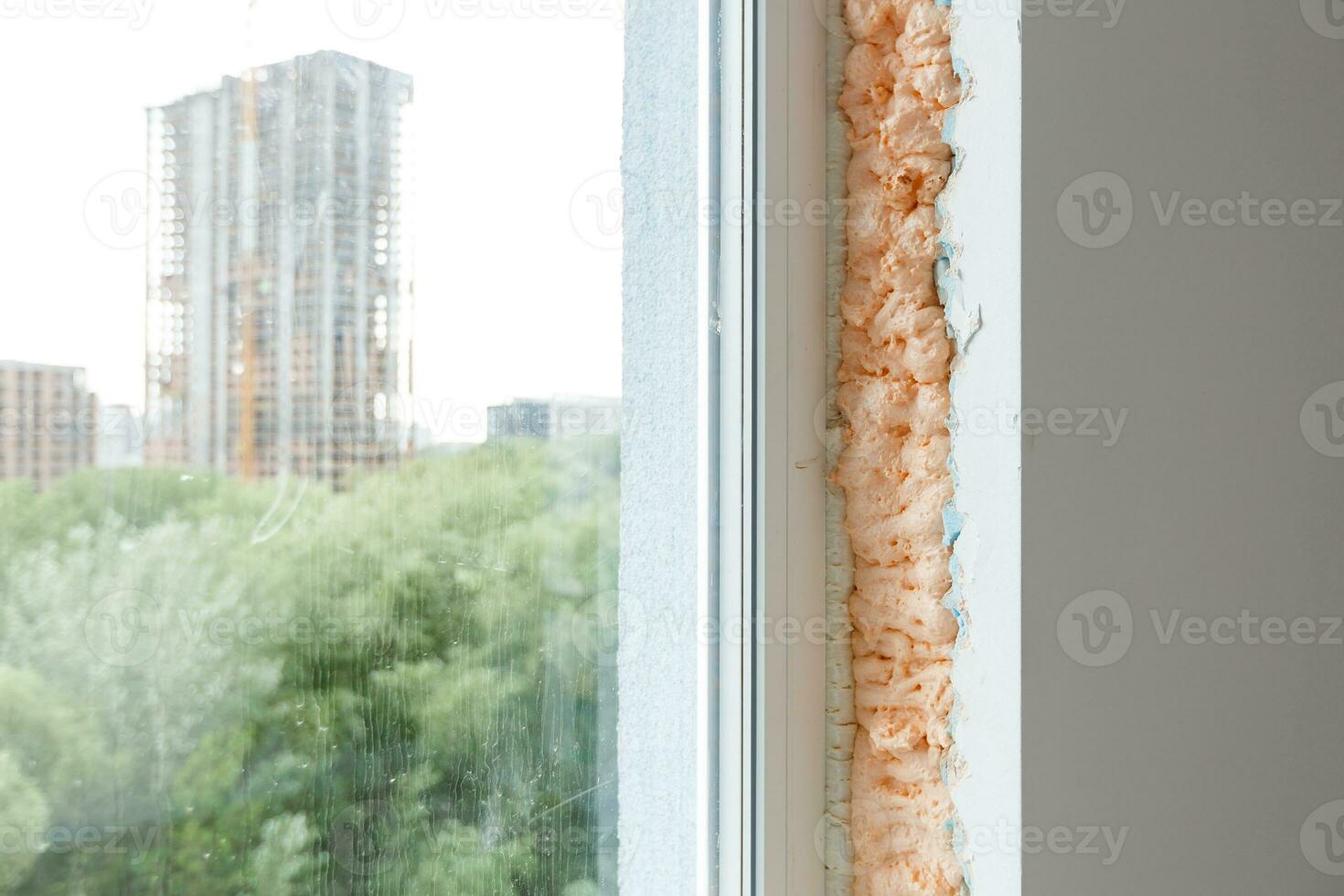Process installation slopes of window. Using a moanting foam. photo