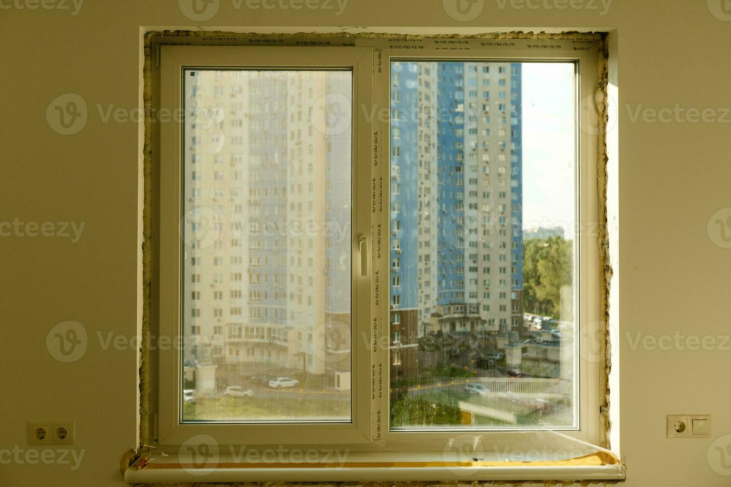 Process installation slopes of window. Using a moanting foam. photo