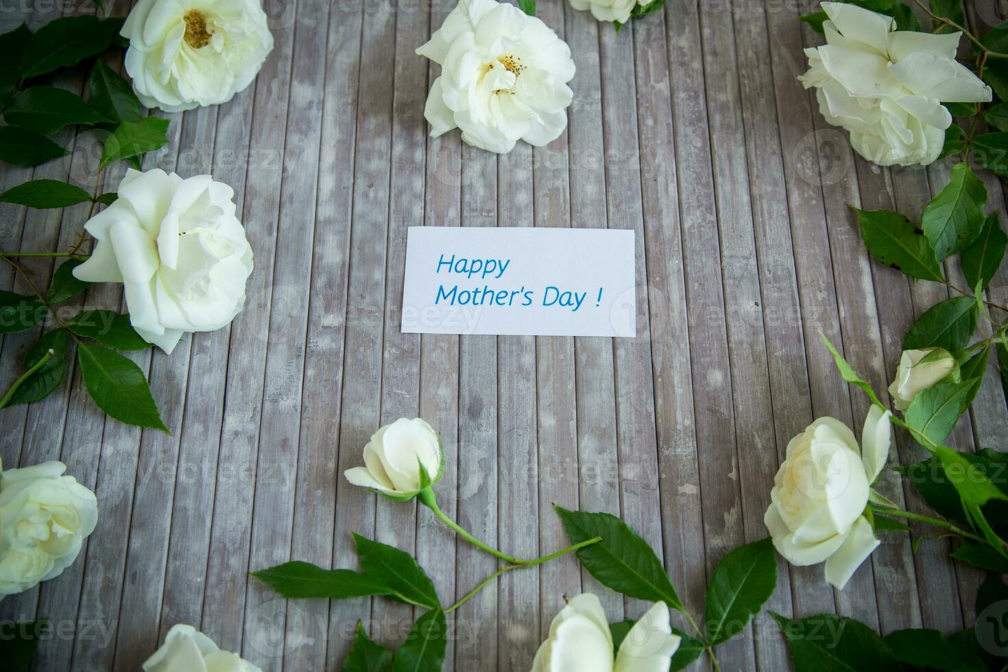 background of many white roses on a light wooden photo