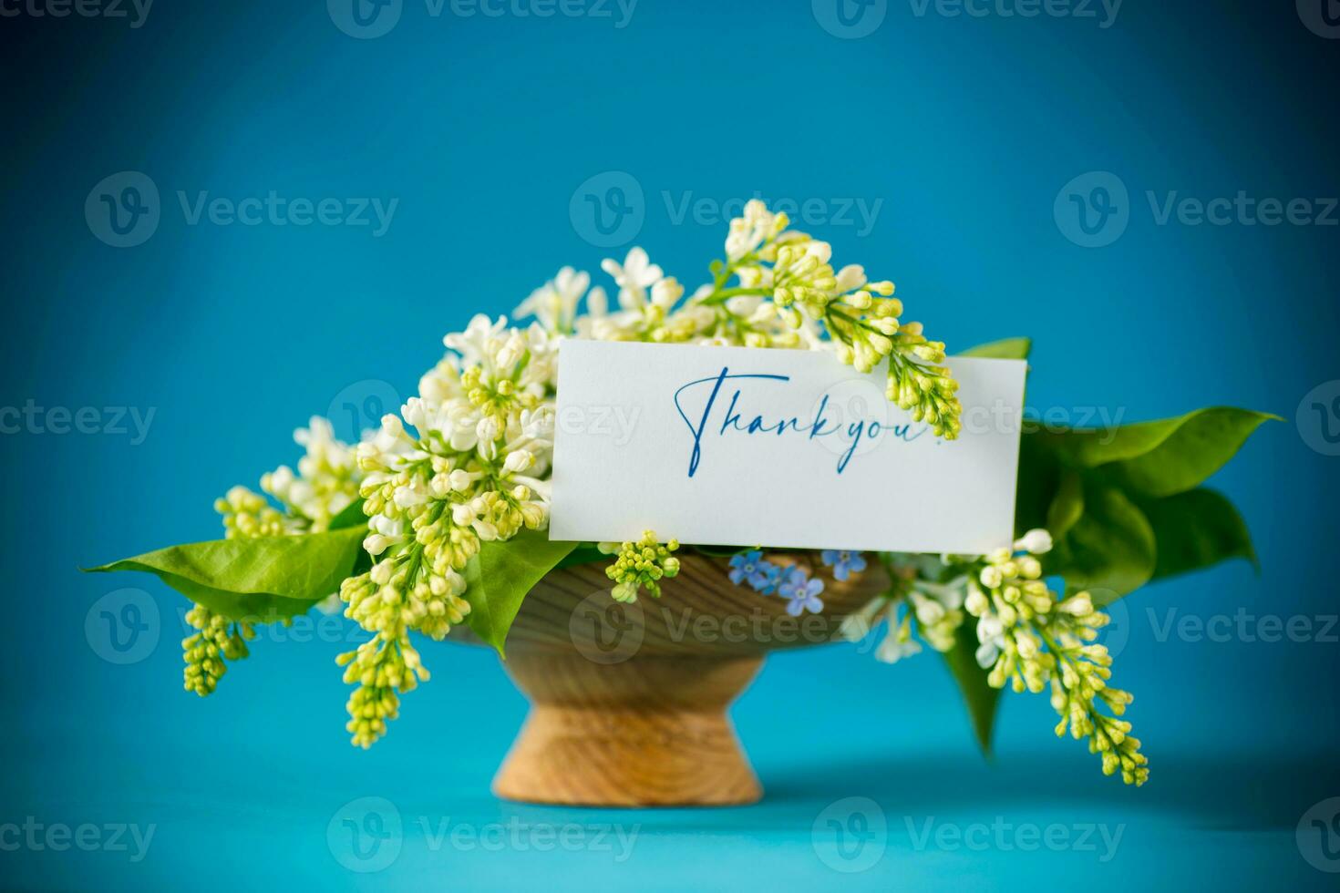 bouquet of white lilacs with greeting card photo