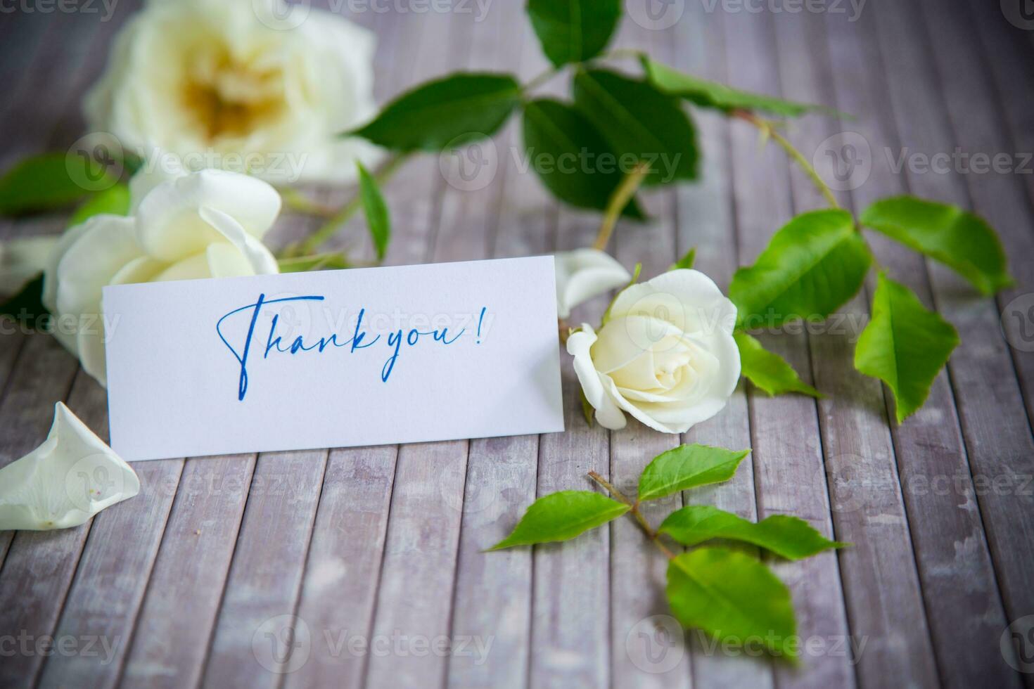 beautiful white summer roses, on a wooden table photo