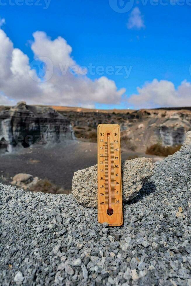 a thermometer on the lava field photo