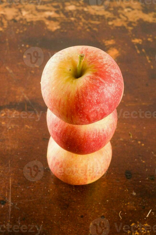three apples stacked on top of each other photo