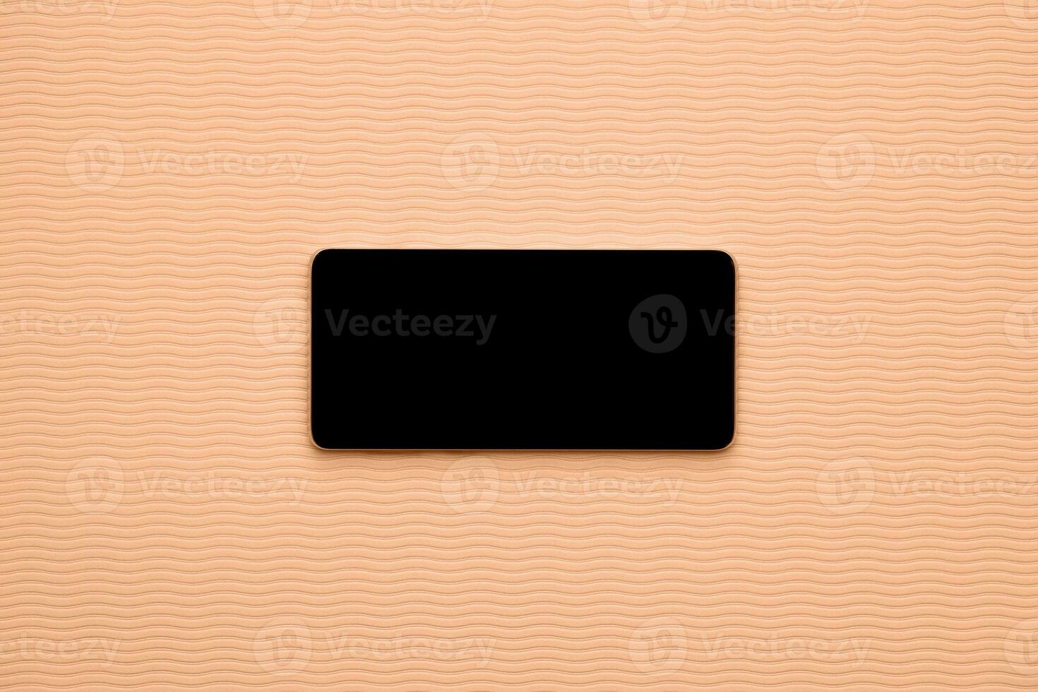 Horizontal blank phone on wave background peach color of the year 2024 photo